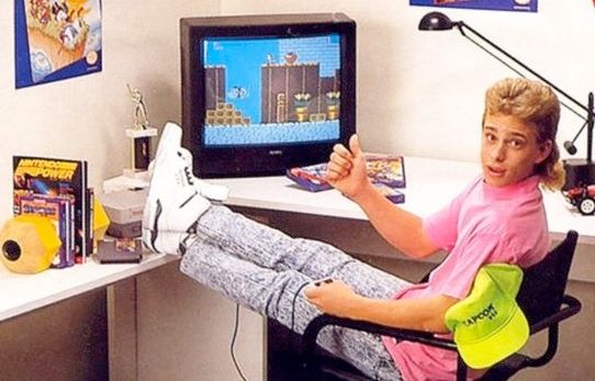 Cool 80s kid with mullet, neon pink shirt & acid-washed jeans playing video games on a CRT TV 
