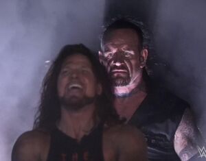 Undertaker standing behind AJ Styles