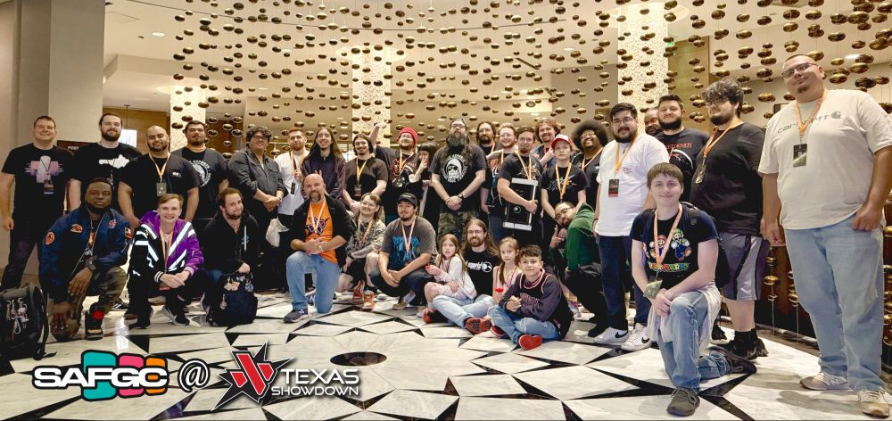 A beautiful wide angle shot of San Antonio FGC (the best FGC) members at the Texas Showdown hotel venue with both SAFGC and TXS logos in the bottom left corner.