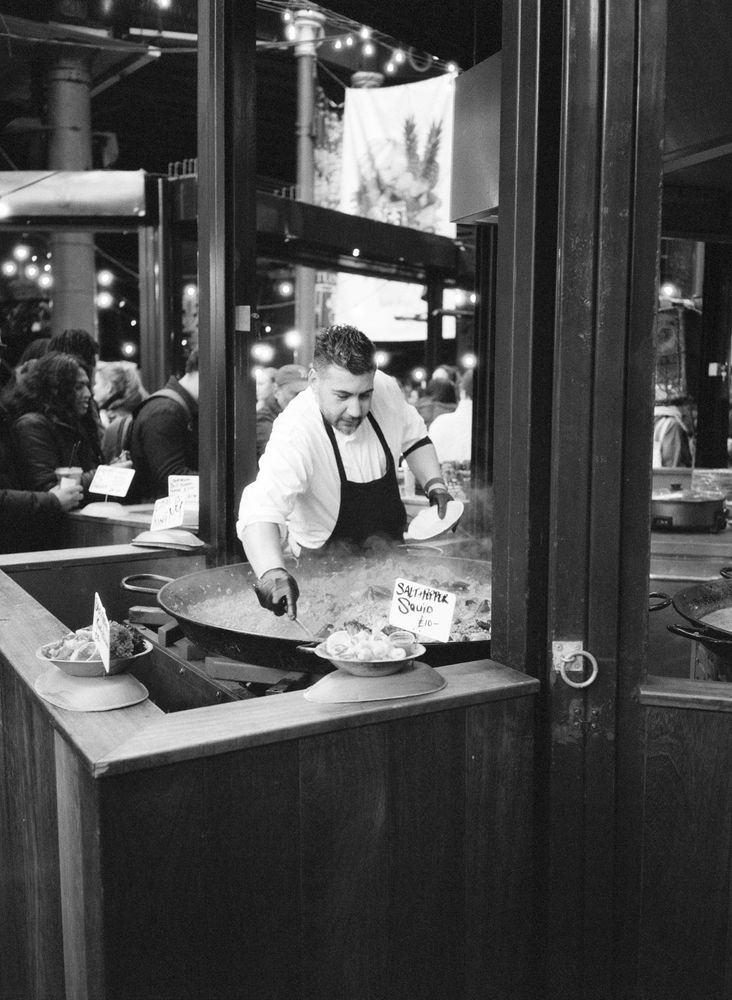 Paella being made in a big pan at Borough Market.