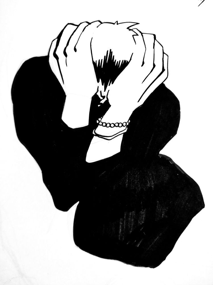 A person holding their head and hunching over