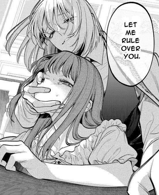 A woman holding another woman down in a sexy position saying "Let me rule over you"