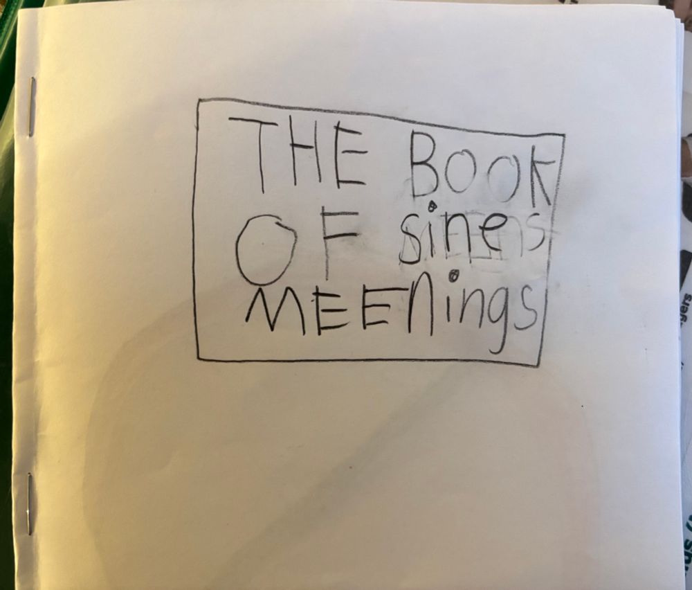 Photo of a hand drawn book cover, whose title reads “The book of sine meenings.”