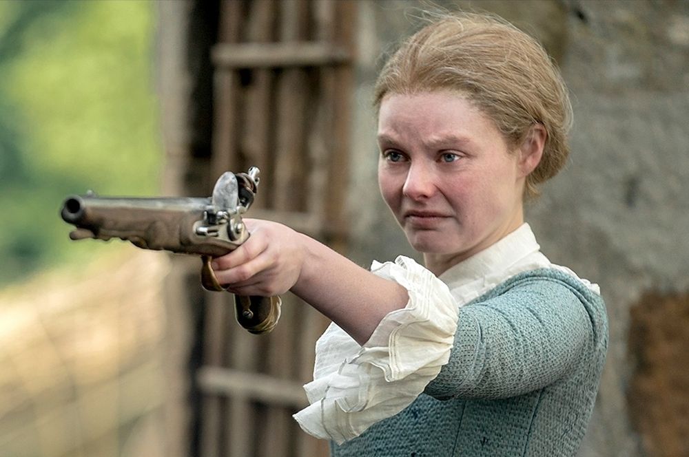 Laoghaire from outlander pointing a pistol to the left. The two images are funny separate, and together, demonstrate inner turmoil. Why is Laoghaire pointing a gun at herself? Is it symbolic? Who will shoot first, left or right? Only time may tell. 