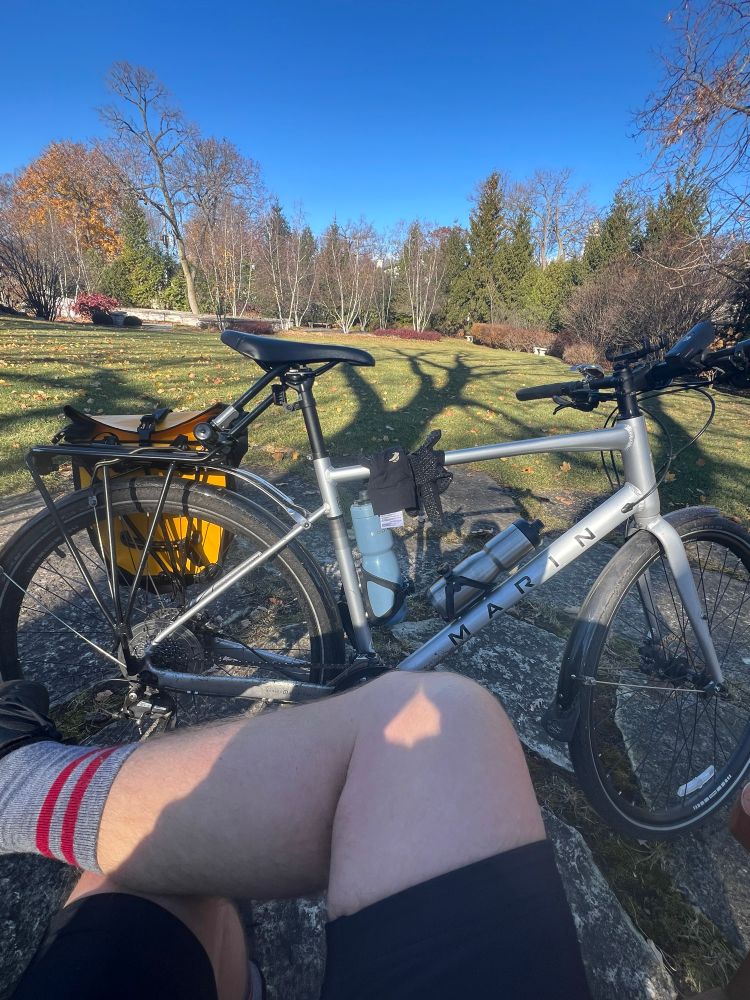 The author while taking a break in the garden/columbarium of Glencoe Union Church.