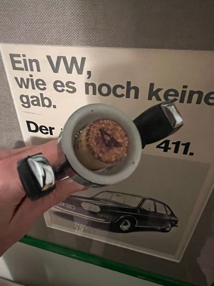 Author holds a corkscrew which has just been used to open a bottle of wine. The screwed cork is fully intact.