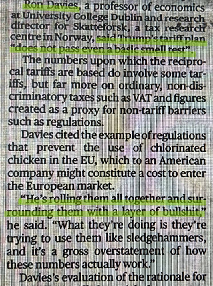 Photograph of newspaper article with highlighted quotes from Ron Davies, professor of economics at University College Dublin, statting that Trump's tariff plan "does not pass even a basic smell test" and "He's rolling that all together and surrounding them with a layer of bullshit".