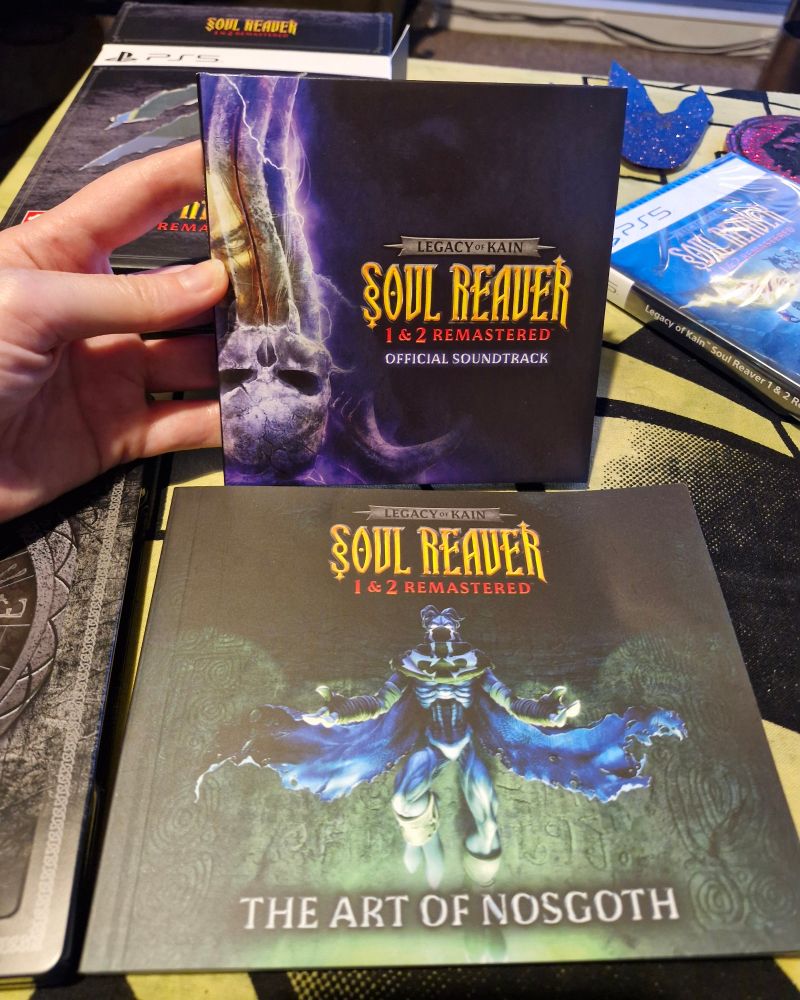 a copy of the soul reaver 1 & 2 soundtrack and a copy of 'the art of nosgoth' 