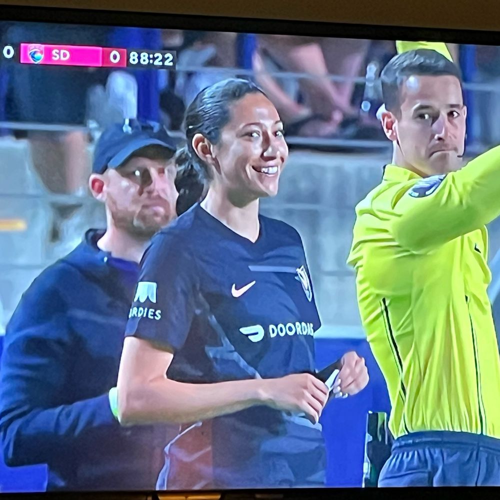 Christen Press stands by the side ref ready to sub in after two years.
