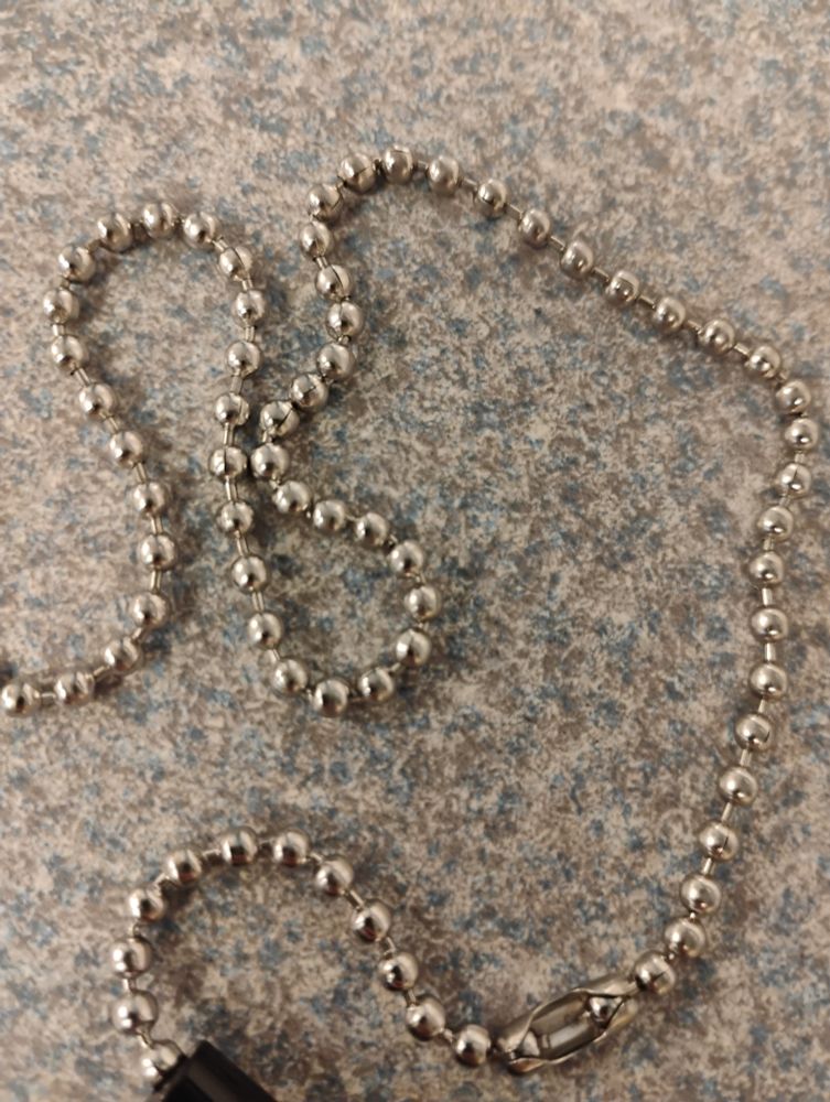 The bead chain attached to a pen at a bank