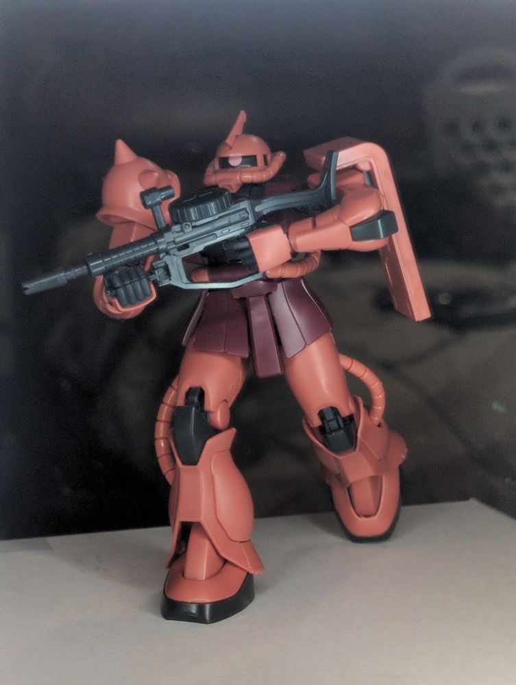 A completed MS-06S ZAKU II armed with an assault rifle