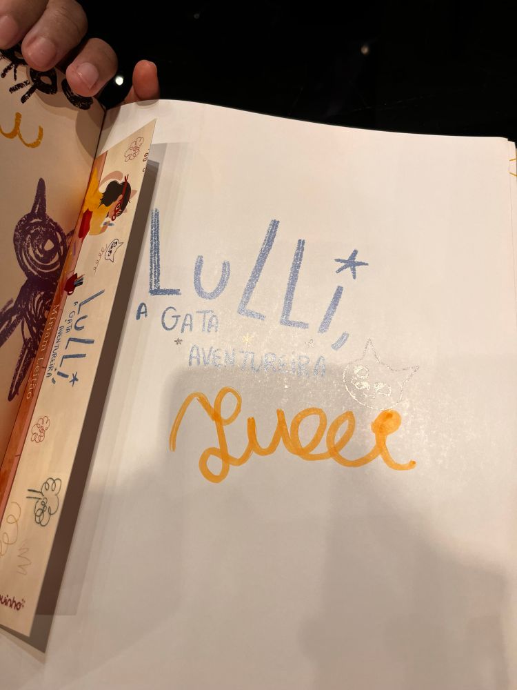 Autógrafo da menina Lulli, em seu livro