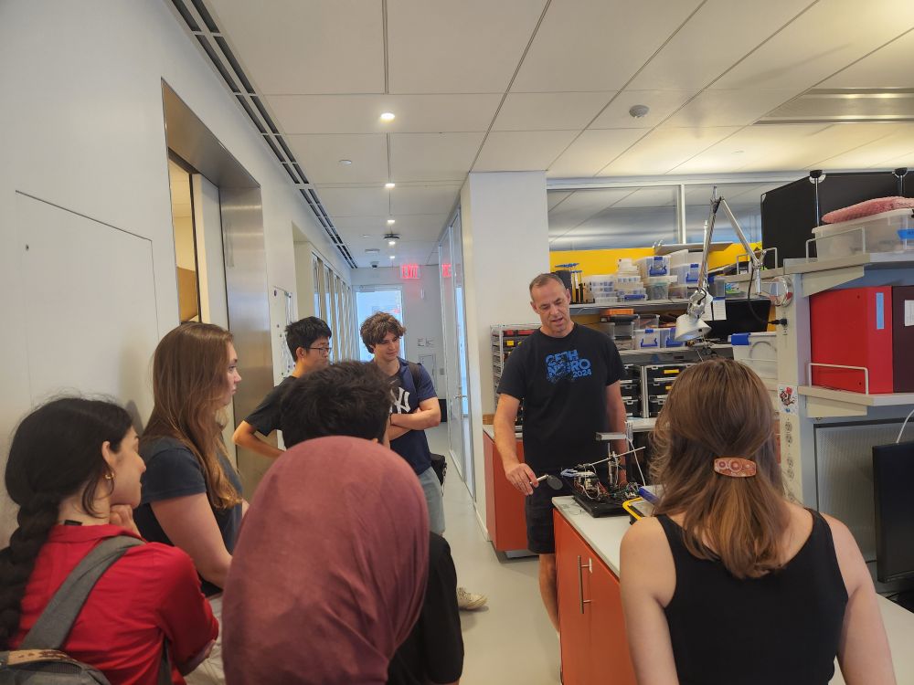 Darcy Peterka showing instruments used in the Institute