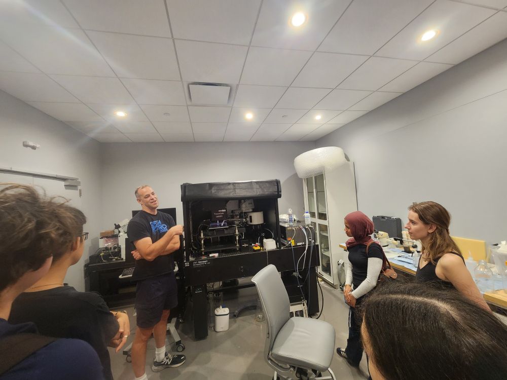 Darcy Peterka showing the serial two-photon tomography system