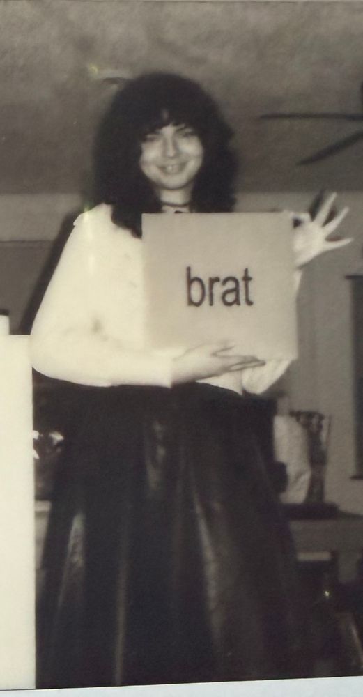 polaroid picture of me grinning and holding the brat vinyl
