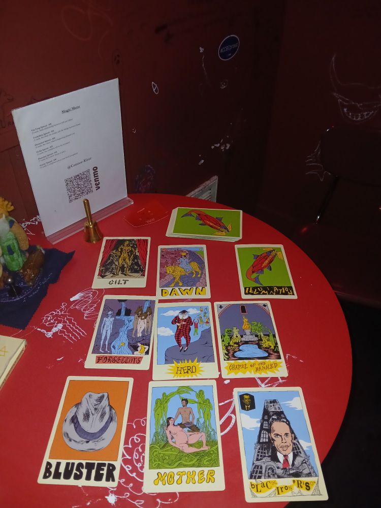 Swirling arcane forces are revealed in the cards of the N.O.D, while a felt sculpture of Enki peaks in
