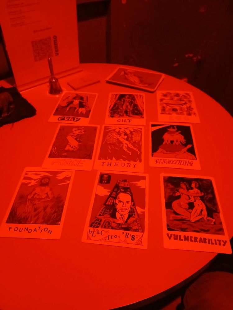 Cards of the N.O.D. reveal an arcane map of the present moment, while a bell waits to dispel this genius tempus