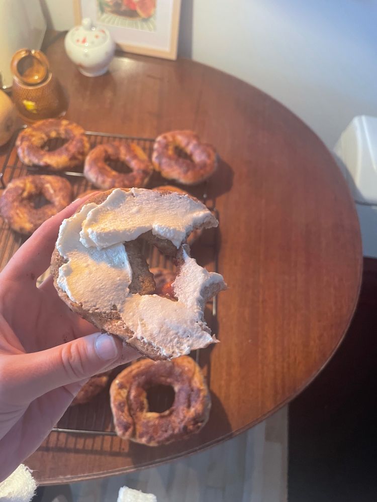 Half eaten bagel with cream cheese
