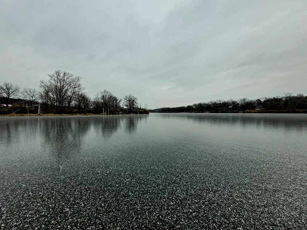Frozen lake with a cloudy sky
