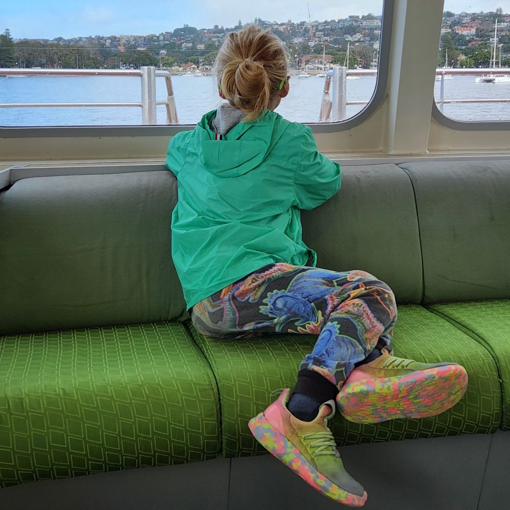 My kid riding on a ferry