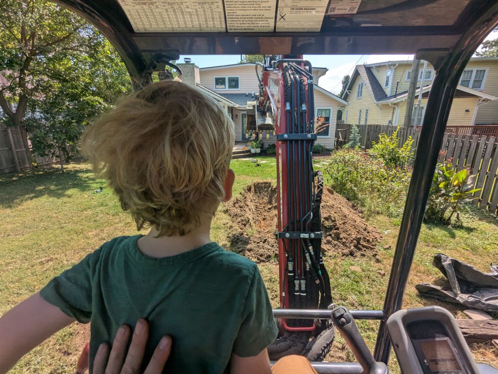 boy driving an excavator 