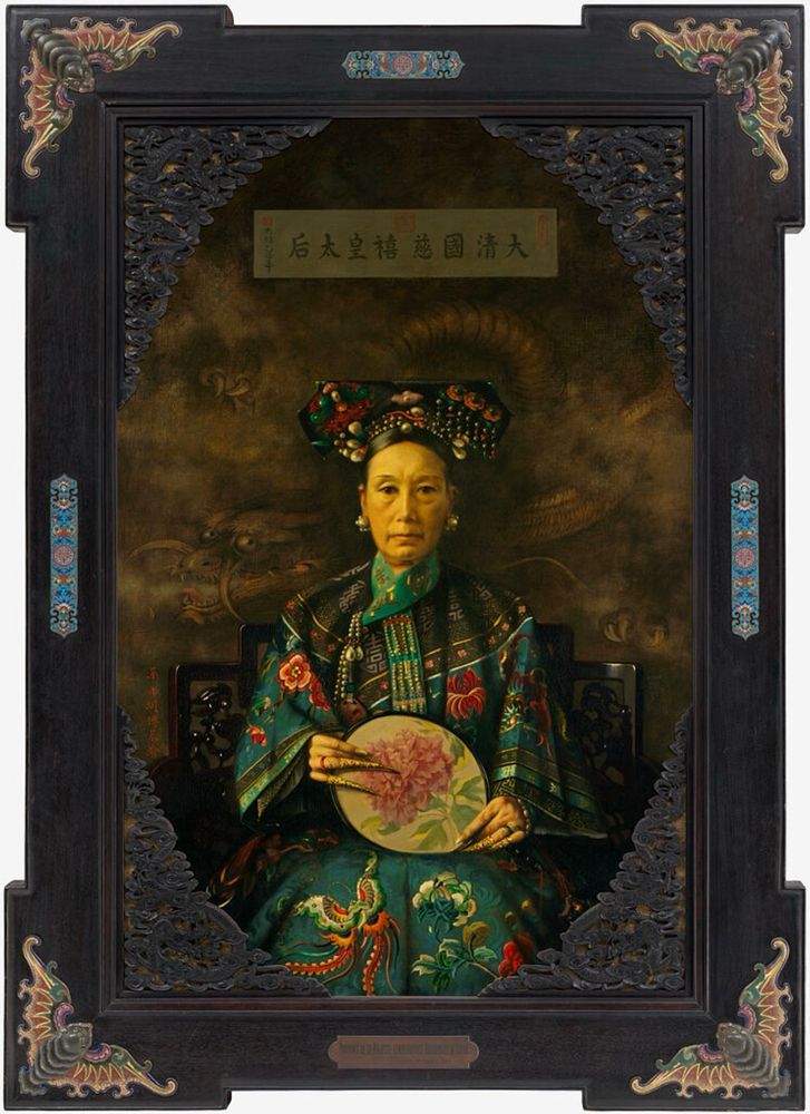 The painting "H. I. M., (Her Imperial Majesty) the Empress Dowager of China, Cixi" is a portrait of the powerful and influential Chinese Empress Dowager Cixi (慈禧太后) in late Qing dynasty of China. She rose from being a concubine to effectively ruling China for decades, significantly shaping the country's modernization and reforms.

In 1905, Vos, now an American citizen, returned to China and was asked to paint the dowager empress. Cixi, who had been on the throne for 40 years when Vos arrived, was a notorious figure who had been much gossiped about in Europe and the U.S. It was whispered, for example, that she had poisoned her nephew and had his favorite concubine thrown down a well. 

Vos had to appear at court at 5 a.m. to meet her, and was given only four brief sessions in a studio on the top floor of a Beijing hotel. In his letters he later related his impressions of his subject:

“Erect, with a tremendous will power, more than I have ever seen in a human being. Hard, firm will and thinking lines, and with a brow full of kindness and a love for the beautiful. I fell straight in love with her.”

Vos ultimately painted two portraits of the Empress, who was 71 years old. She looks considerably younger, and the artist reportedly enlarged her eyes and plumped her lips at Cixi’s request.

She wears elaborate traditional Chinese royal attire, including a headdress adorned with jewels and beads. The details of her teal, green, and gold clothing are intricate, featuring flowers, birds, and other decorative elements.

Her expression is serious, and her gaze is steady. The Empress Dowager holds a round, ornate fan, decorated with a painted image of a peony flower. Her fingers are adorned with long, elaborate gold nail guards.

The background is a muted, brownish-gold hue, with a subtle dragon design. Above her head, a rectangular banner contains Chinese characters with her royal name and title. She is seated on a dark wooden chair with intricate carvings.