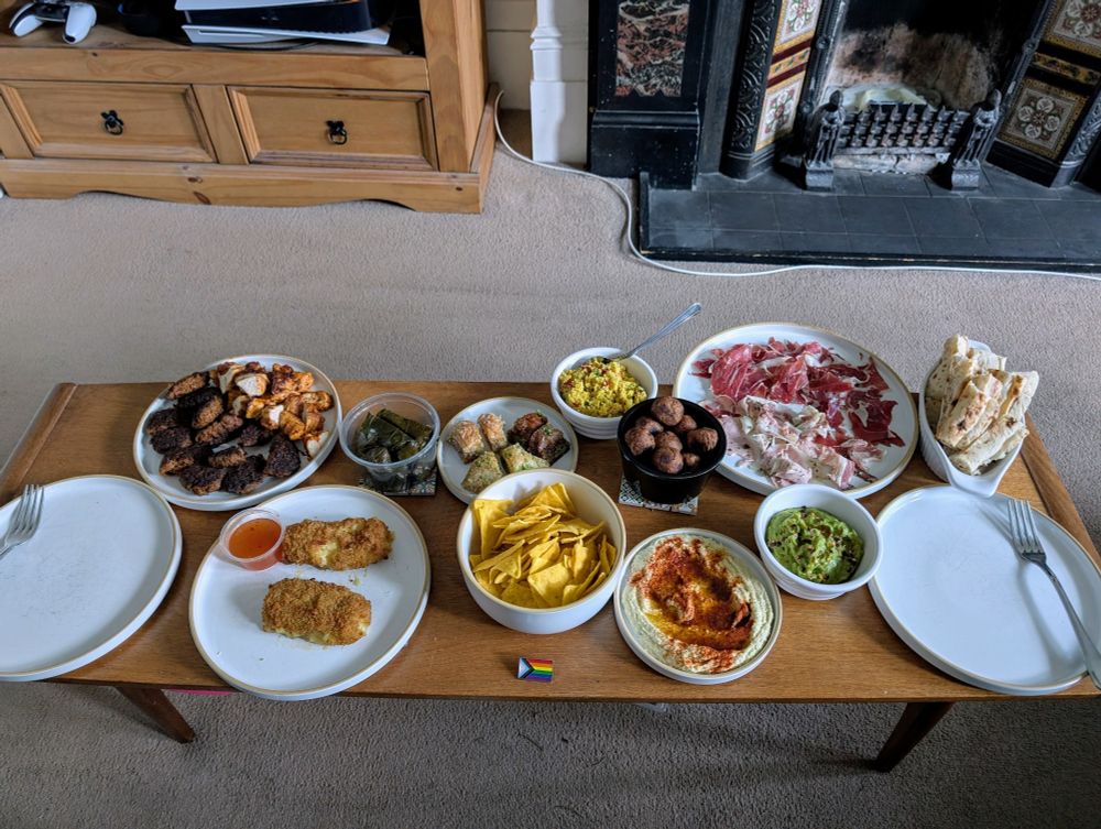 A coffee table full of (mostly) European snacks