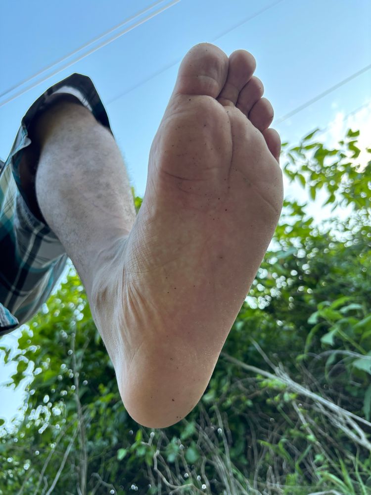 Stoney’s sole as his foot is about to come down on you, bottom of his feet showing with visible creases in his feet