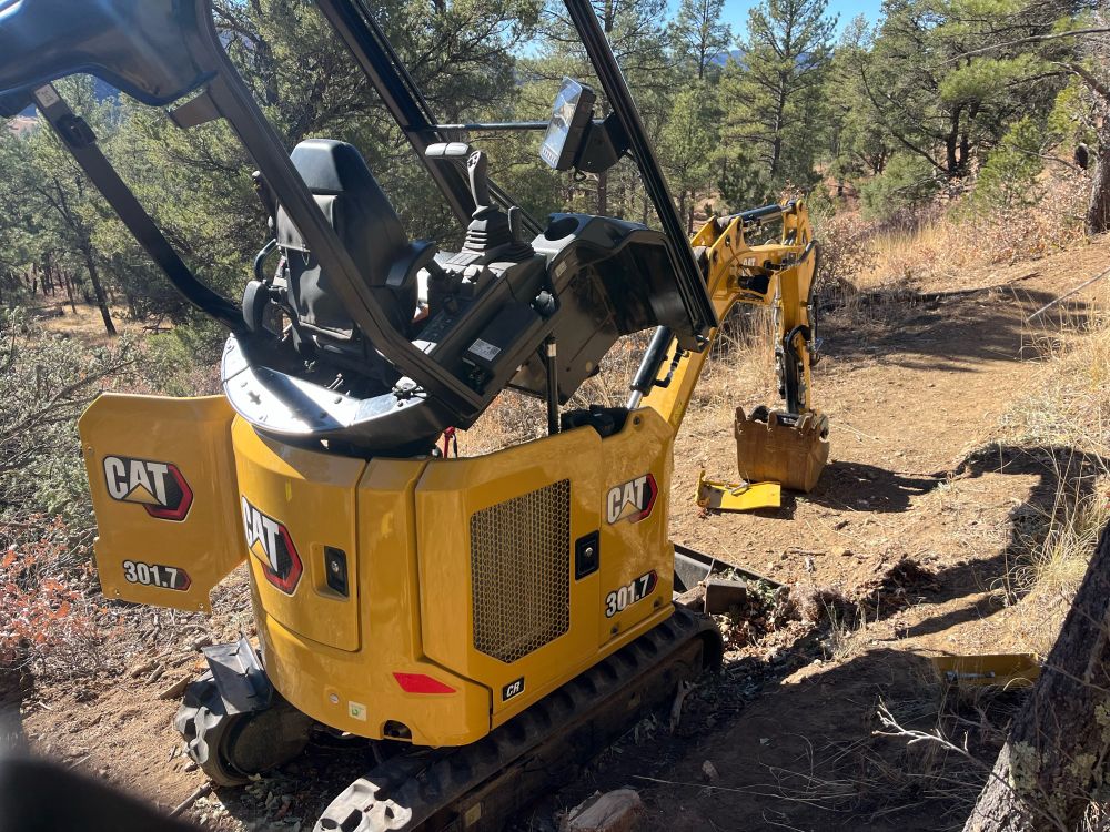Mini Excavator with the top opened for repair