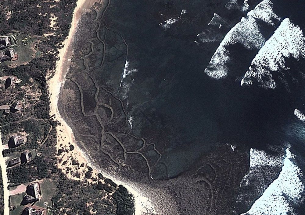 Arial image of Stillbay fish traps South Africa. Sources Goggle Maps.