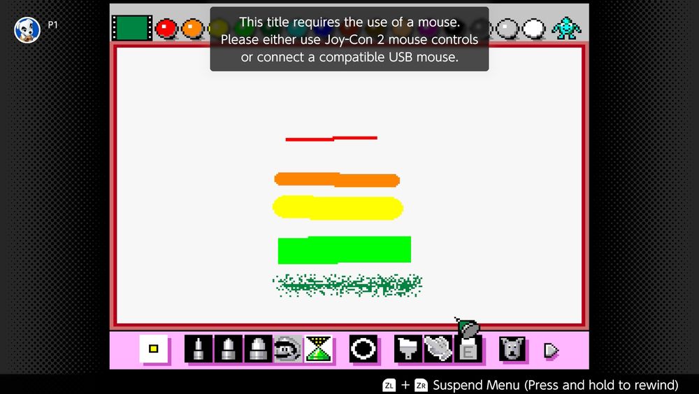 A screenshot of Mario Paint running on a Switch 2, displaying a message that the title requires the use of a mouse. Please either use Joy-Con 2 mouse controls or connect a compatible USB mouse. The screen also has a few different colored lines drawn using different brushes resulting in different thicknesses, or one that looks like a spray can line.
