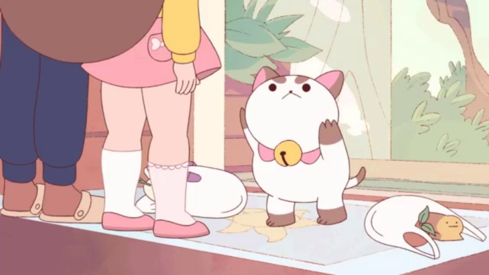 a cartoon cat with a bell around its neck is standing next to a girl