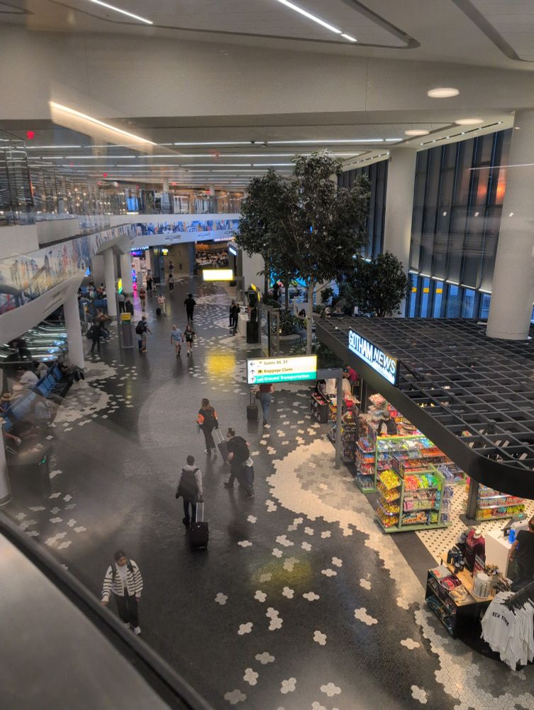 Photo looking down on concourse B at LGA airport in Queens, NY. 