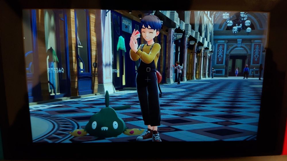 Same player character happily posing with trubish