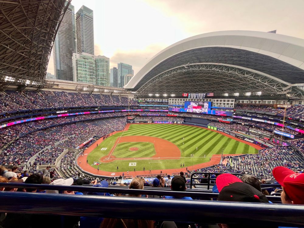 A photo of the beginning of a Blue Jays game inside the Rogers Centre, with the dome open.