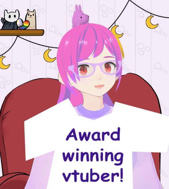 Monday Moon smiling while wearing a very simple shirt with 'Award winning vtuber!' put on top of her regular sweater. The shirt looks like it was made in MSPaint in three seconds, because it basically was.