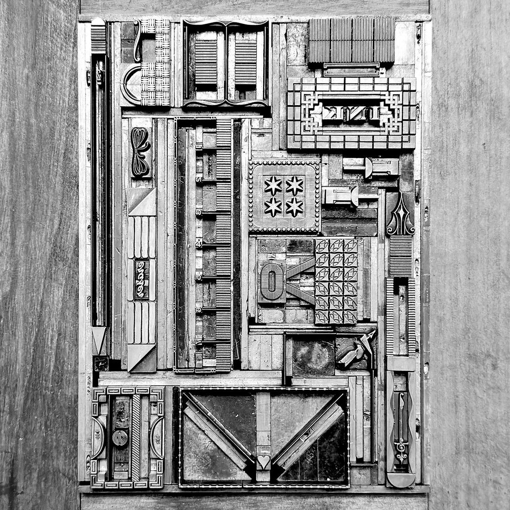 Metal type form used for printing the stationery print. In black and white. 