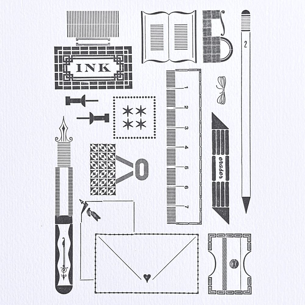 Closeup of letterpress print featuring stationery items built from metal type and ornament. Soft gray ink on white textured paper. 