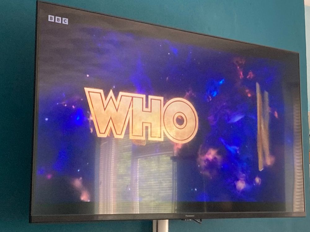 Photo of a TV open to the Whoniverse ident at the beginning of “The Reality War”.