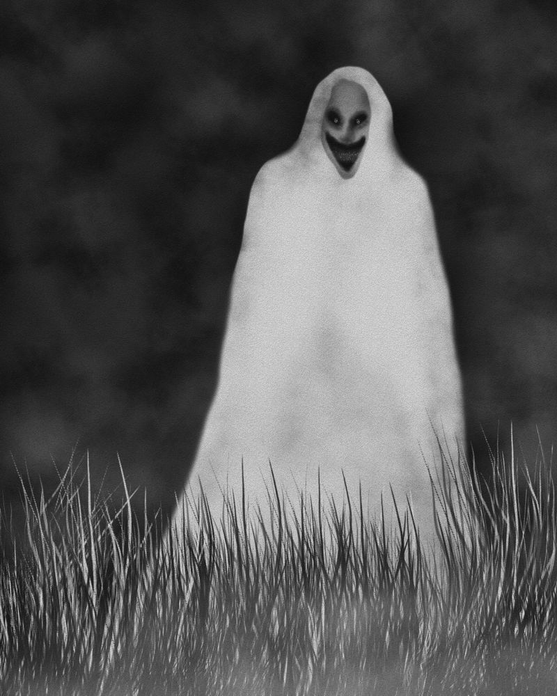A man standing in a field smiling