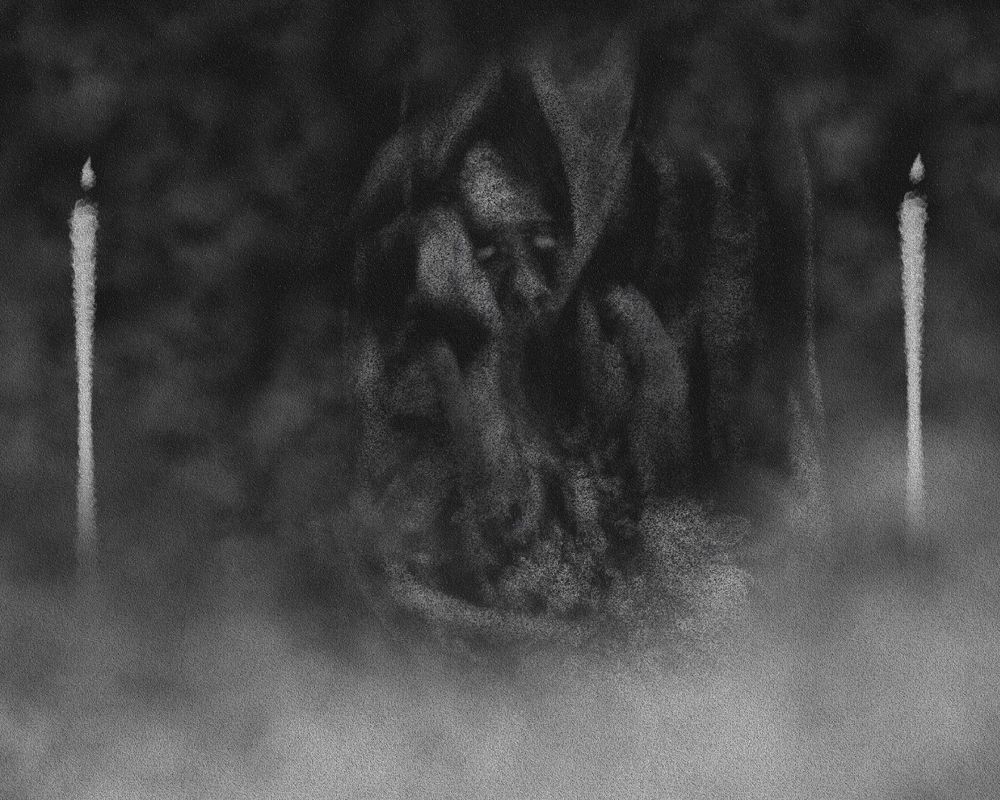 A face embedded into a tree trunk surrounded by 2 candles