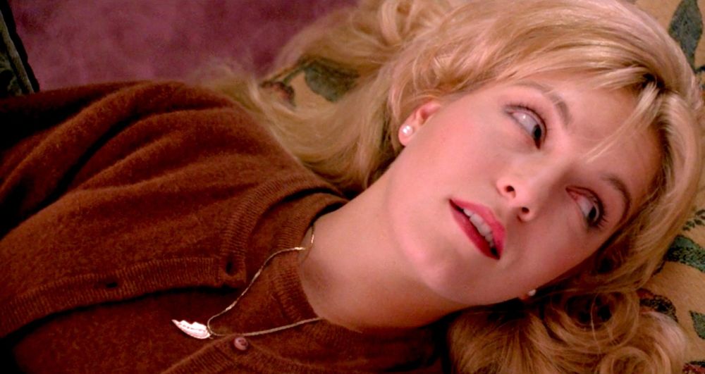 Laura Palmer, lying on her back, looking up and across the room from her.