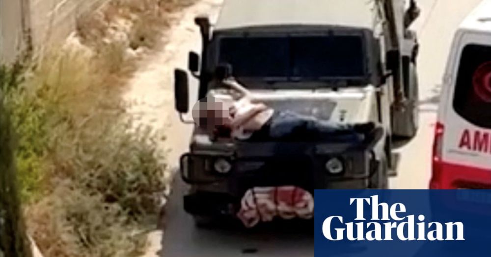 Israeli forces strap wounded Palestinian man to hood of military jeep