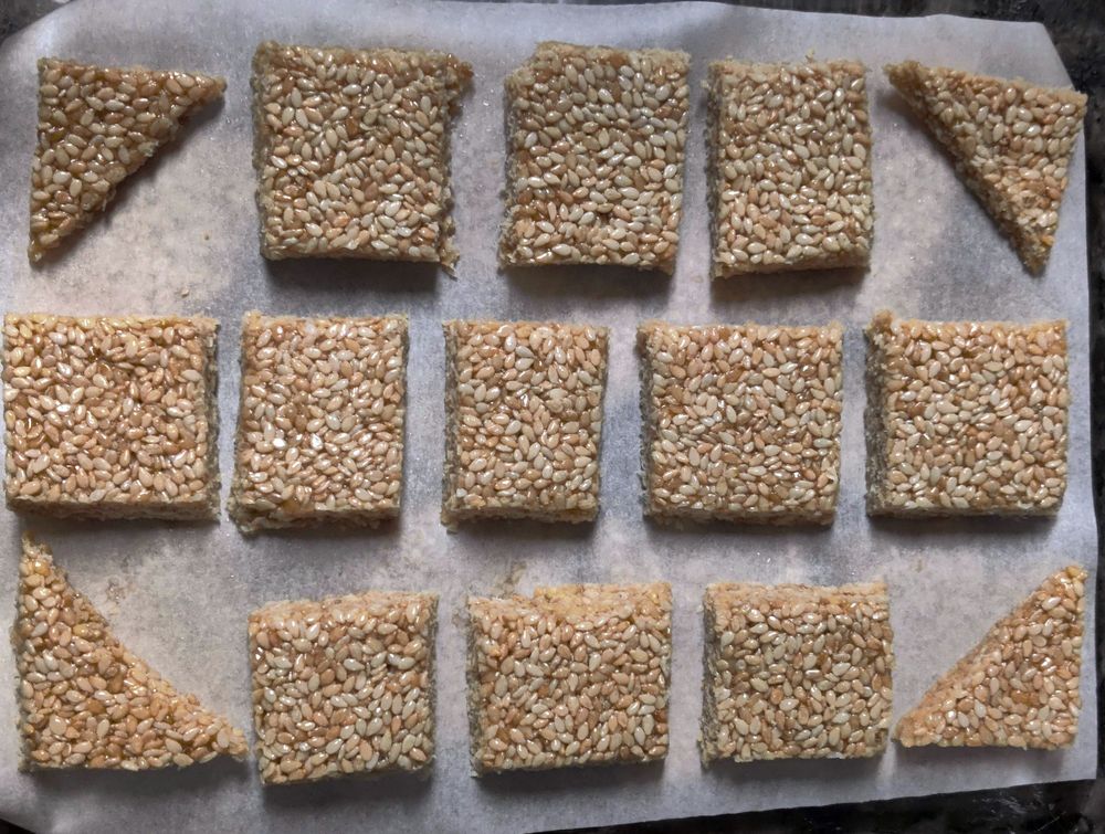 Honey sesame bars (pasteli) arranged neatly for storage.