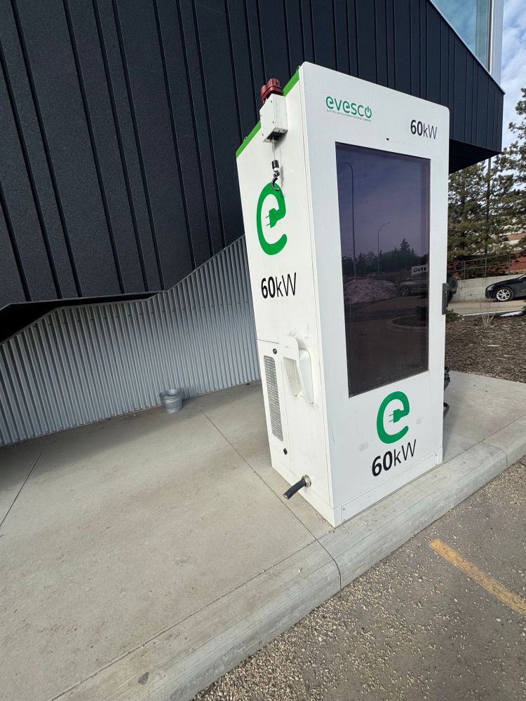 EV charging station with its charging port cable cut off.