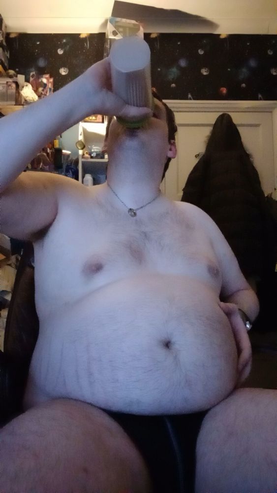 Obese feedee drinking gainer shake and whole milk