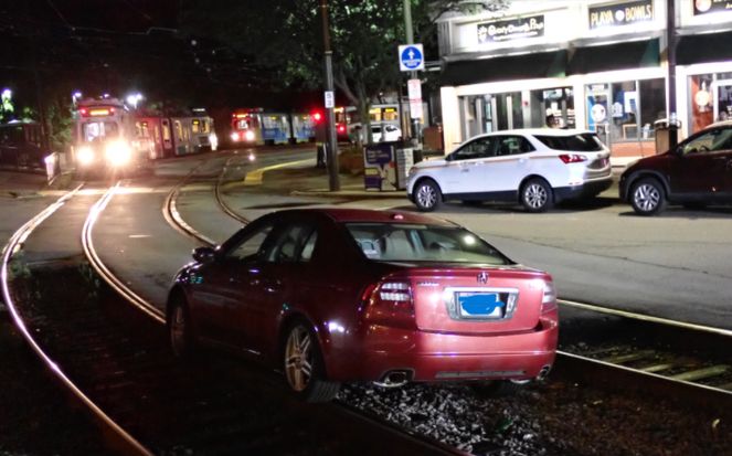 Car stuck on Green Line tracks at BC