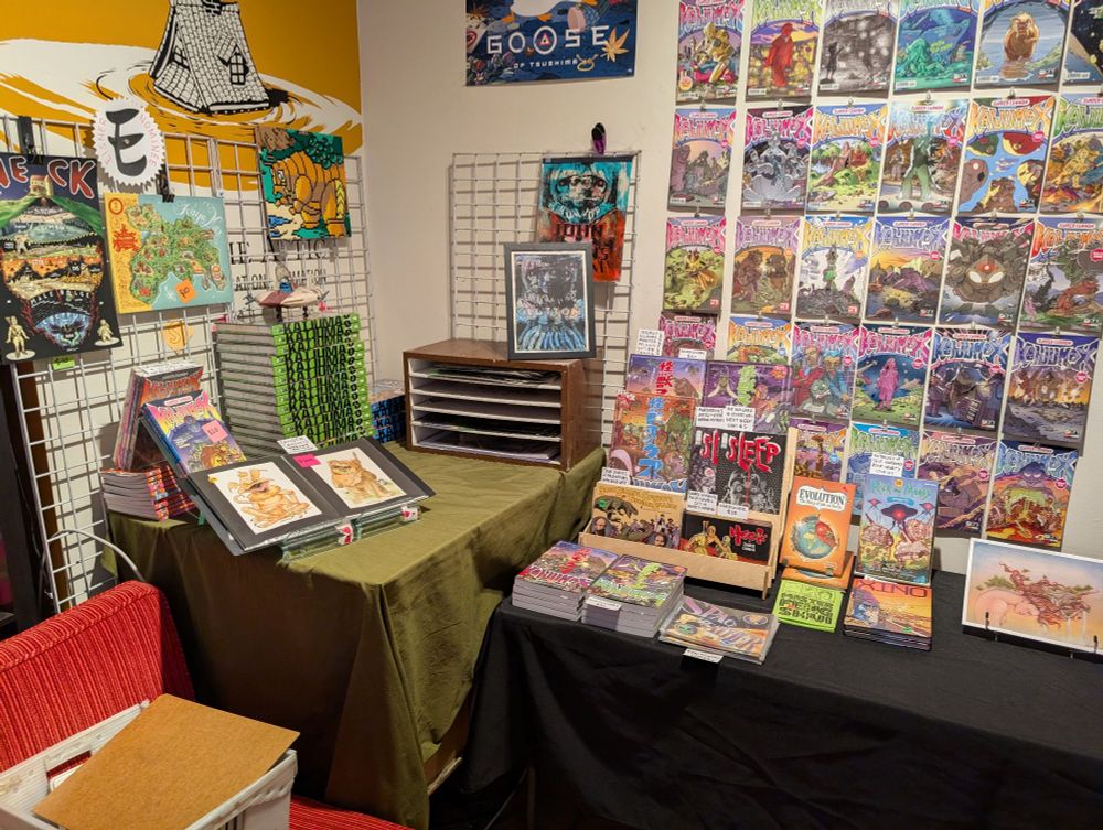 A convention-like spread of comic books, mostly by beloved Twin Cities cartoonist Zander Cannon