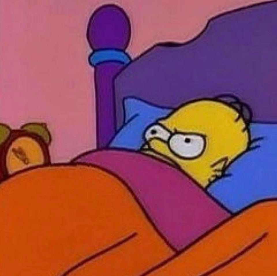 Meme of Homer Simpson lying in bed looking very angry. 