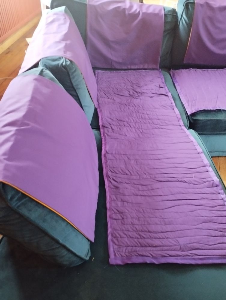 One thing off the long-term to-do list today: It's taken a year, but the sofa now has proper antimacassars. Reversible purple/yellow to fit with our overall decorating scheme. Just need final hand finishes tonight & that's job done.